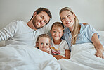 Relax, happy and portrait of family in bed in the morning for wake up, support and quality time together. Smile, peace and weekend with parents and children at home for bonding, connection and care
