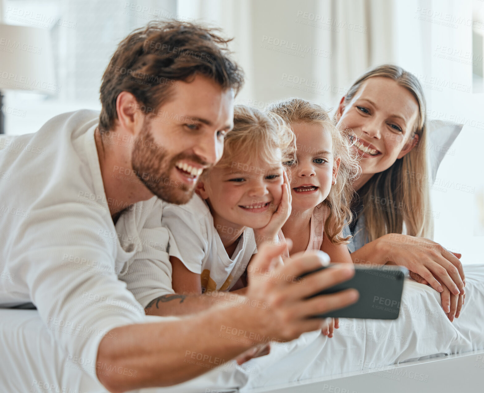 Buy stock photo Happy family, selfie and smartphone in bedroom together for love, care or relax in family home in morning. Smile parents, excited children and cellphone of digital photo, fun and happiness lifestyle
