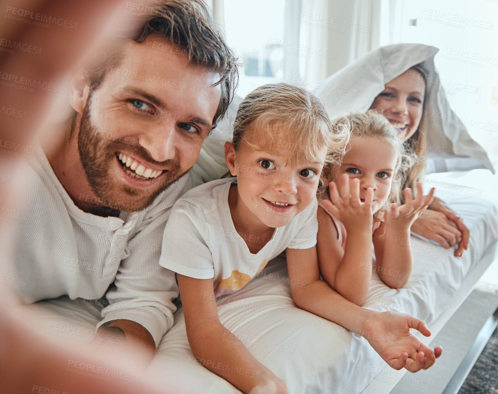 Buy stock photo Selfie, family and bed with parents and children posing for a photograph together in the morning at home. Bedroom, love and picture with a mother, father and daughter siblings bonding in the bedroom