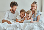 Tablet, movie and family in bedroom streaming a lovely series on subscription online and relaxing on a lazy morning. Mother, father and children watching tv for bonding and entertainment on a weekend