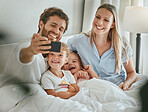Phone selfie, family and relax in bed together bonding, smiling for mobile photograph for social media. Happy parents, excited smiling children and digital tech smartphone in bedroom at home