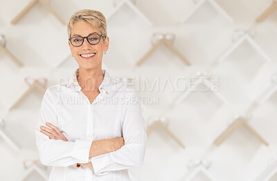 Buy stock photo Portrait, glasses and vision with a woman optometrist standing arms crossed alone in her optometry store. Ophthalmology, eyewear and frame with a mature female optician selling frame lenses
