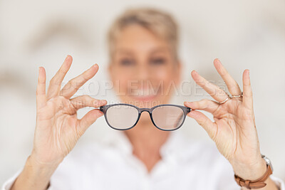 Buy stock photo Vision, eyesight and glasses in hands with blur, woman has poor eye sight holding spectacles in blurred background. Healthcare, medical insurance and eyes, prescription lens in clear spectacle frames