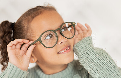 Buy stock photo Child, glasses and eye care for vision, focus and concentration while wearing quality lens frame optician choice. Face of girl looking happy about optics fashion mockup for eyesight correction