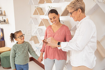 Buy stock photo Glasses, vision and children with a mother and daughter at the optometrist for an appointment to test prescription lenses. Family, consulting and eyewear with a woman customer buying frame lenses