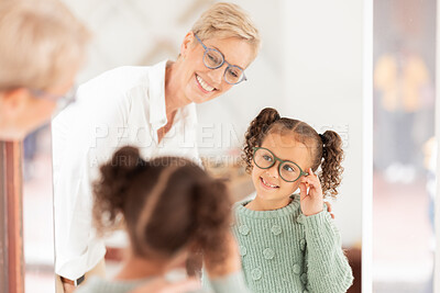 Buy stock photo Eye care, girl and optometrist help with vision, prescription glasses and eye test for childcare. Child, eyes and medical professional talking about clear sight for reading, improvement and eyewear.
