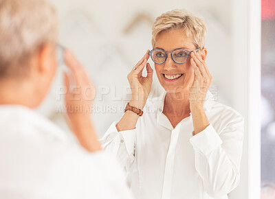 Buy stock photo Senior woman, smile and mirror for glasses, vision or eyesight at optometry store. Happy elderly female smiling in happiness for new spectacles looking at reflection in eye care at the optometrist