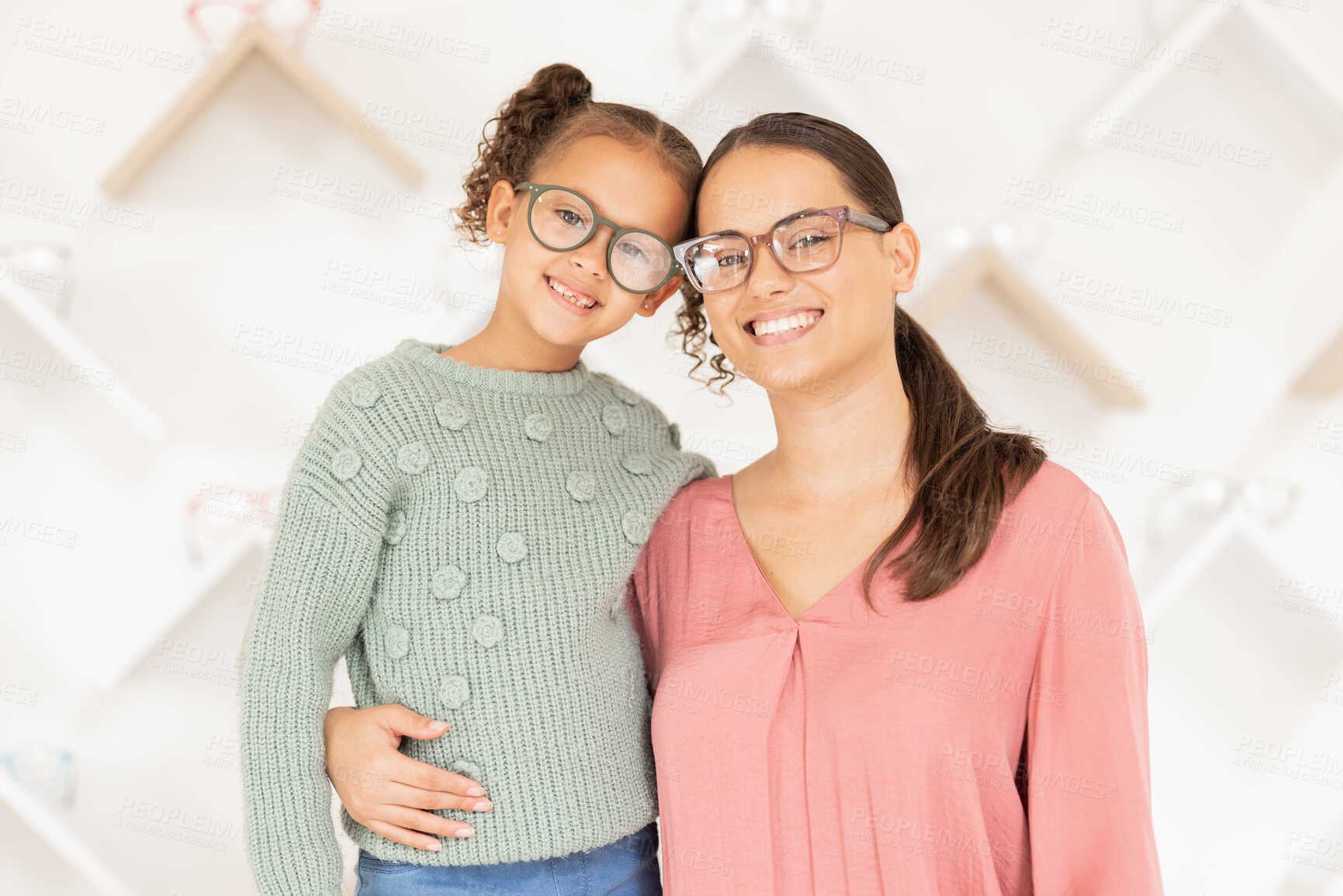 Buy stock photo Portrait, mother and girl with glasses for vision, hug and smile being happy for eye care, loving and eye exam together. Eyewear, mama and daughter embrace, eyesight and healthcare for strong eyes.