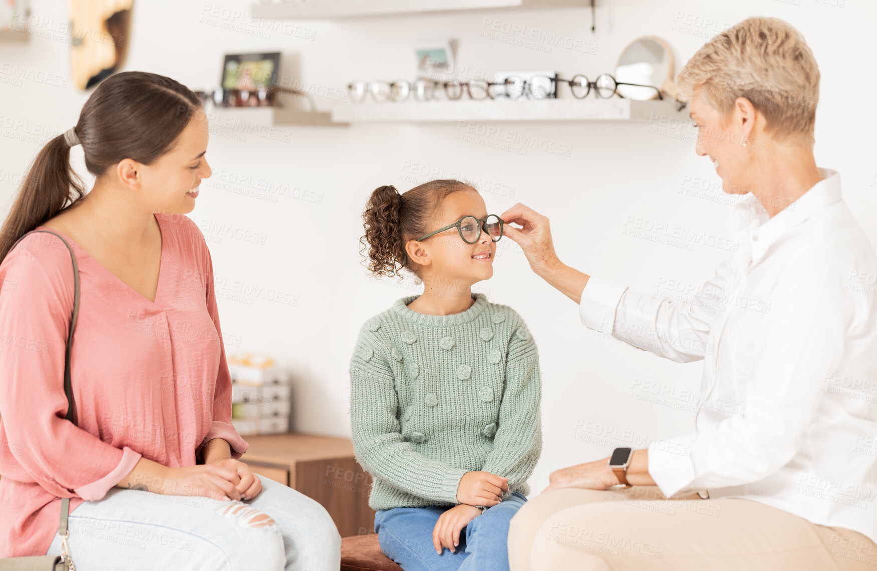 Buy stock photo Vision glasses, mother and child with optometrist for eye care consultation, prescription eyeglasses or eyesight test. Optometry lens store, ophthalmology healthcare support and patient at eye exam