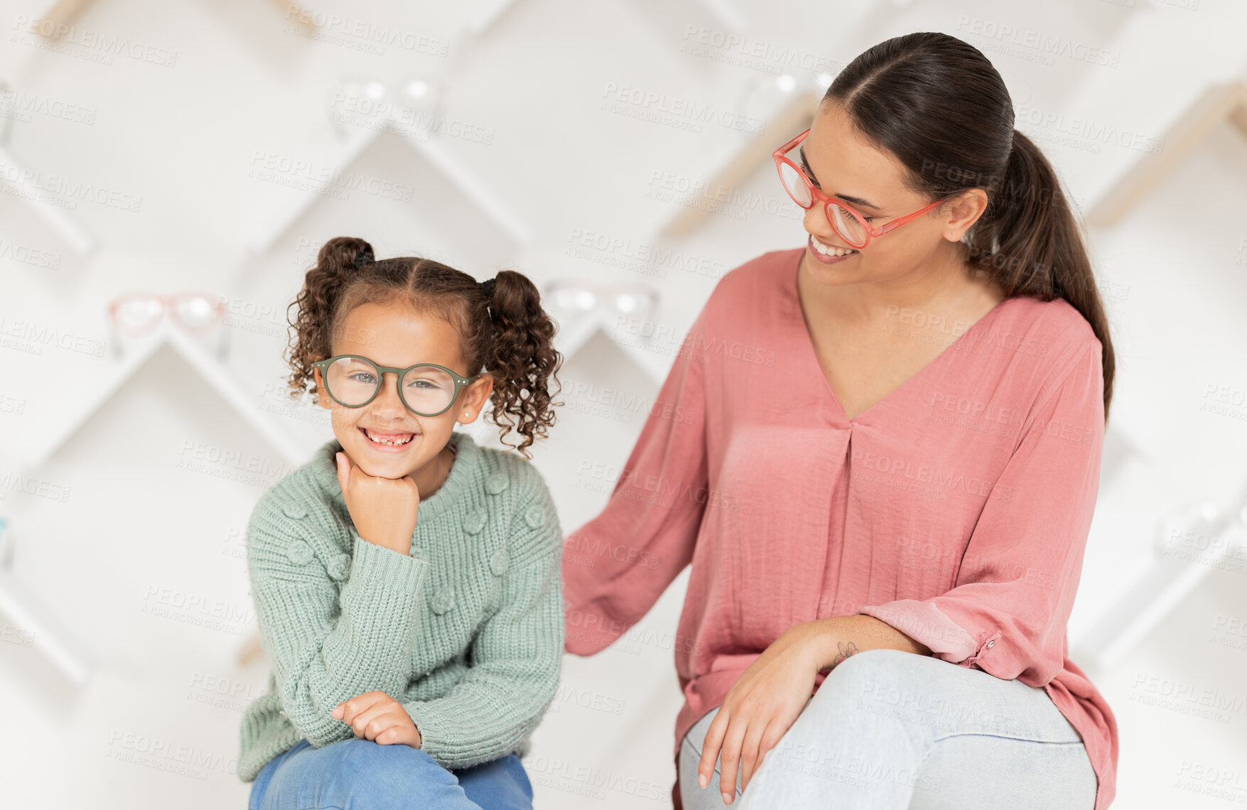 Buy stock photo Shopping, vision and glasses with mother and girl buying eyewear together in retail store. Woman, daughter and consumer optics while buy eyeglasses in optometry shop for eye health and eye care 