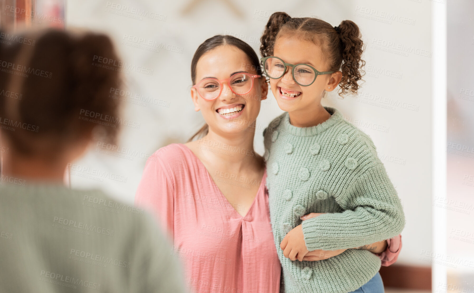 Buy stock photo Family, optics store and shopping with mother and child looking at glasses choice in mirror for eye care, vision and optical health. Woman and girl customer with fashion lens or frame in retail shop