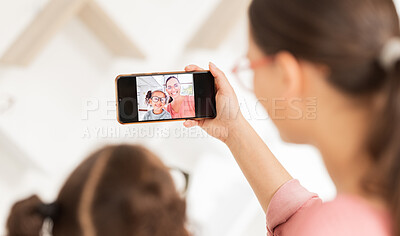 Buy stock photo Family phone selfie, mother and girl at optometry hospital taking picture for happy memory together. Love, care and 5g mobile photo of mom bonding with kid for social media, online or internet post.