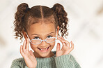glasses, child face and eye care for vision in optometrist office. Excired young girl, happy and smile for eye exam, eyes healthcare treatment and optometry lens fashion portrait for wellness support