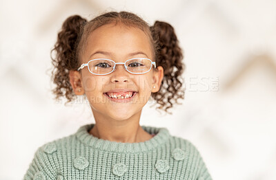 Buy stock photo Glasses, vision and children with a girl customer in an optometry office for new frame eyewear. Portrait, retail and eyesight with a young female child at the optician for prescription lenses