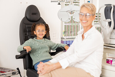 Buy stock photo Children, vision and glasses with a girl customer and optometrist consulting in an office for an eye test. Portrait, eyewear and retail with a female child and optician consulting in an appointment