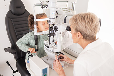 Buy stock photo Girl child in eye exam for vision, woman optician checking kids eyes in consultation room and medical test. Healthcare professional consulting kid, young patient with optometrist or optical doctor