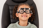Trial frame, vision and eye test of girl at hospital or optometry clinic for eyewear, health and eye wellness. Exam, glasses and child testing eyesight for new optical lenses, frames or spectacles.