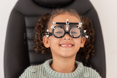 Buy stock photo Trial frame, vision and eye test of girl at hospital or optometry clinic for eyewear, health and eye wellness. Exam, glasses and child testing eyesight for new optical lenses, frames or spectacles.