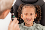 Happy portrait of girl, test eye vision by optician checking child's eyes in consultation room and smile. Healthcare professional consulting kid, young patient with optometrist or dental work
