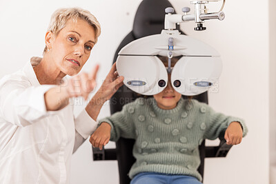 Buy stock photo Vision, eye and test with a child at optometry exam with a specialist doctor in a clinic for glasses. Ophthalmology, optometry and medical expert eye test with little girl for eye health and eye care