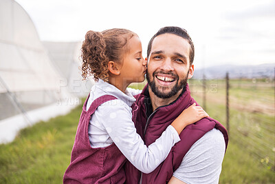 Buy stock photo Farm, father and child kiss dad cheek for bonding and affection on sustainable farming land. Parent, dad and daughter being affectionate with love and care on agriculture and organic green field