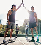Basketball, high five and teamwork with a sports man friends in celebration as a winner on a court. Fitness, goal or success with a male basketball player and friend celebrating a winning achievement