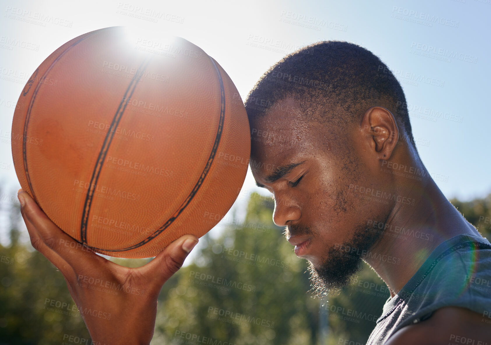 Buy stock photo Basketball, ball and hope of black man thinking and praying outdoor at a community park or sports court for exercise, training and fitness. Face of athlete playing street ball for health and wellness