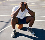 Basketball, sports and depressed man on court with hands on head after loss, fail and bad game. Fitness, sadness and upset black man sitting on ball on outdoor basketball court, frustrated and mad