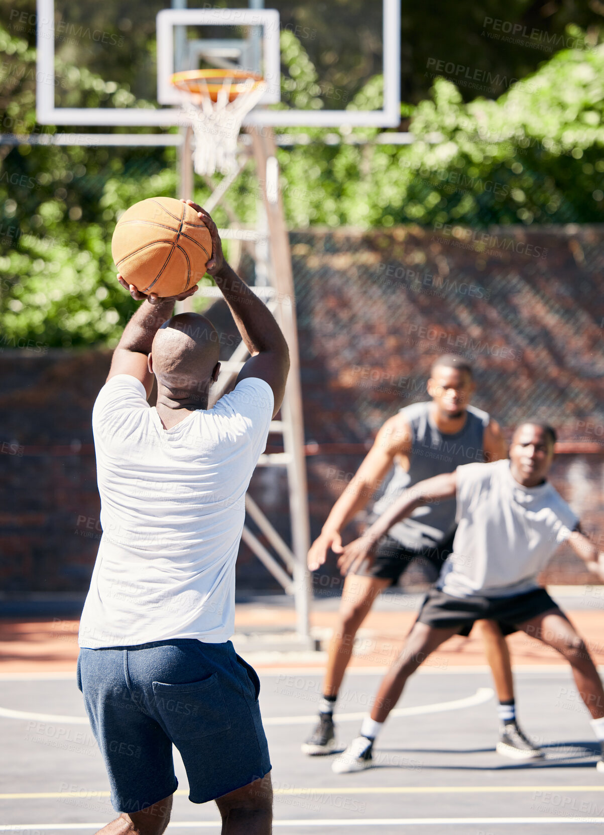 Buy stock photo Basketball, sports and athlete scoring during game or training on an outdoor court in the city. Score, goal and man playing, practicing or doing an exercise for championship match on basketball court