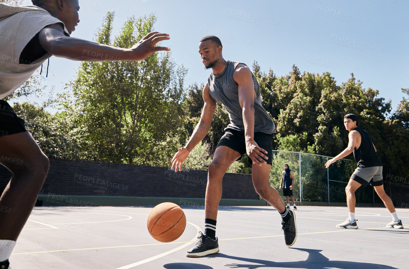 Buy stock photo Fitness, basketball and athlete on an outdoor court playing a match or training as a team. Motivation, exercise and healthy basketball player practicing with a ball for a sports game in South Africa.