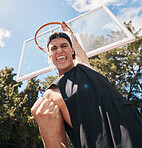 Basketball, man and winner in score for sports game, celebration or match in the court outdoors. Excited, energetic male basketball player celebrating victory dunk or sport success for point outside