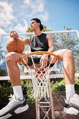 Buy stock photo Basketball, sports and man on basket with ball for fitness, exercise and training workout at a community park with sports sneakers. Basketball player, urban court and game with male athlete thinking