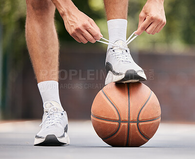 Buy stock photo Basketball, athlete with shoelace, shoes and sport on basketball court outdoor, fitness and exercise motivation. Man, basketball player and ready for game, training and active with cardio and sports.