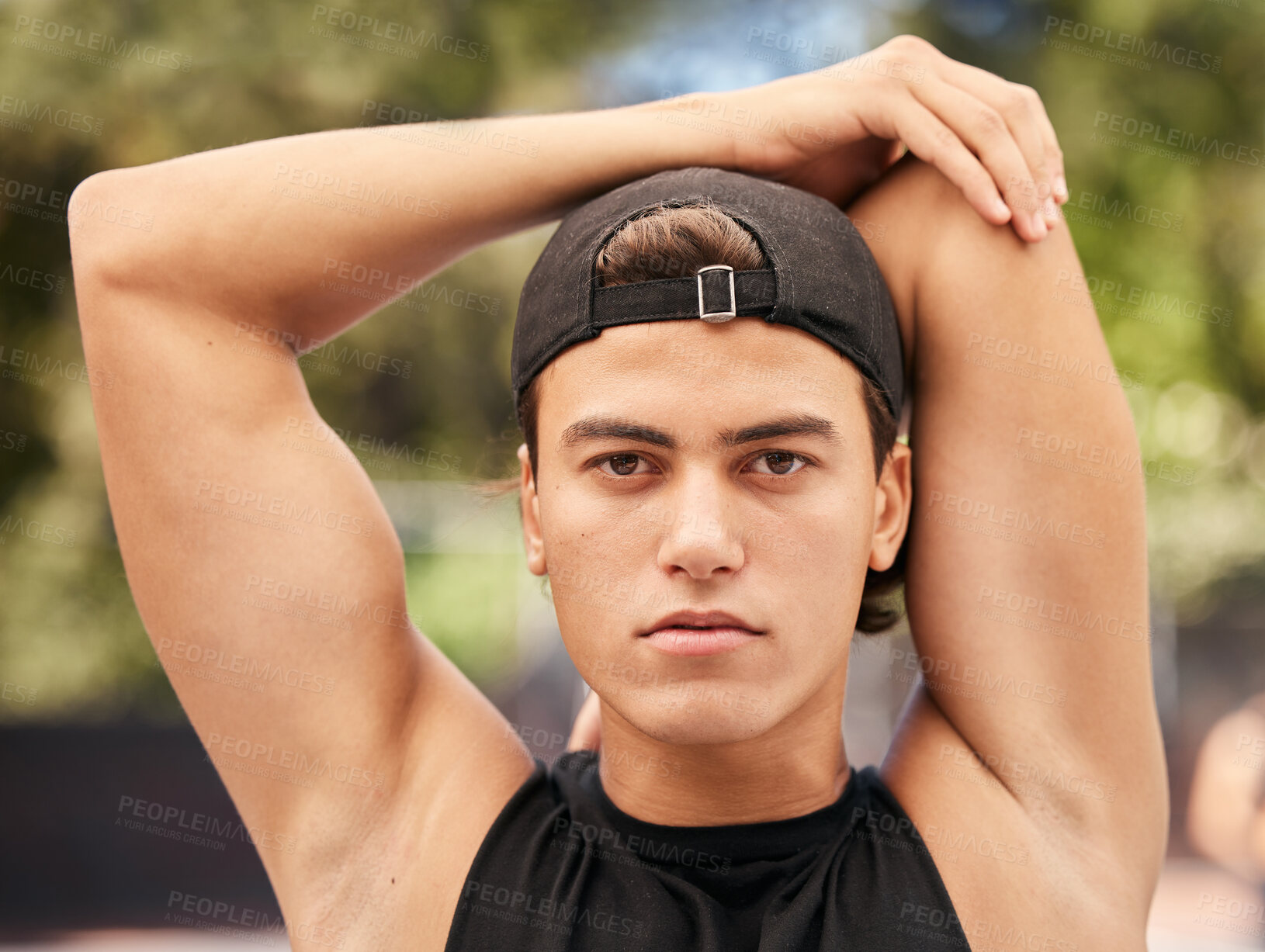 Buy stock photo Face, fitness and stretching with a sports man getting ready for a game outdoor during summer. Portrait, health and exercise with a young male athlete going through his warmup routine for a workout