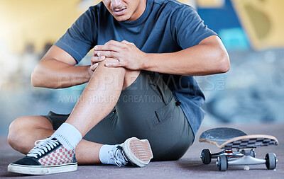 Buy stock photo Man, skateboard and knee injury in street, city or outdoors after stunt training accident or failure. Sports, skateboarding and skater with muscle inflammation, leg or knee pain at urban skate park.
