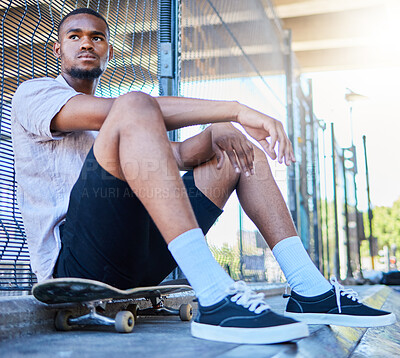 Buy stock photo Cool black man, skateboard and freedom at urban skate park, city and relaxing summer for training, outdoor action and sports hobby in USA. Young skater guy, youth culture and hipster street lifestyle