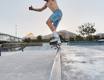 Buy stock photo Skater, fitness and feet of man skateboarding in a park for fun, adventure and fitness. Sports, active and training of a guy using a board to skate outside in an urban city or town for exercise 