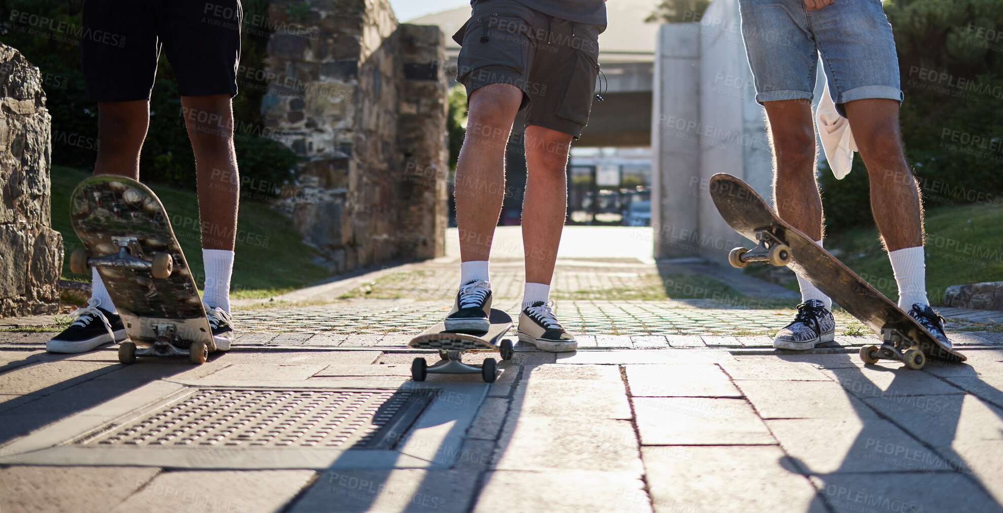 Buy stock photo Shoes, skateboard group and people in street, city or outdoors preparing for practice. Exercise, fitness and skateboarding sports, training and skaters standing together on urban road after workout.