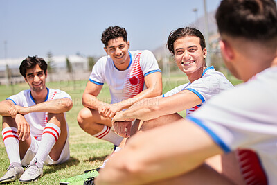 Buy stock photo Soccer, team and meeting in sports conversation for game, planning or strategy on the field outdoors. Happy football players in teamwork, collaboration or communication in sport or fitness training