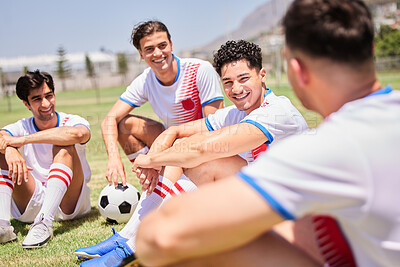 Buy stock photo Soccer, relax and team on a football field talking, team building and laughing at a funny joke at training. Happy, fitness and sports athletes bonding and enjoying conversation after a game in Brazil
