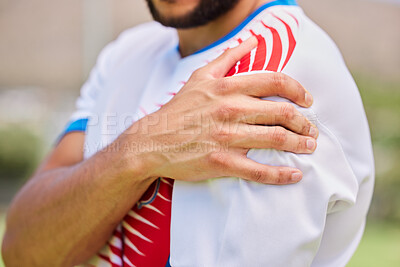 Buy stock photo Sports, soccer and hands of man with shoulder pain from training game, soccer field accident or fitness exercise workout. Athlete emergency, injury problem and hurt football player with muscle strain