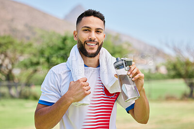 Buy stock photo Portrait, fitness and soccer player drinking water in training, cardio exercise and football field workout. Happy, sports and healthy man relaxing and enjoying a resting break with a liquid beverage