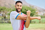 Fitness, portrait and soccer player stretching in training, workout and warm up exercise on a soccer field. Smile, healthy and happy sports man ready to start playing a football match or game in Peru