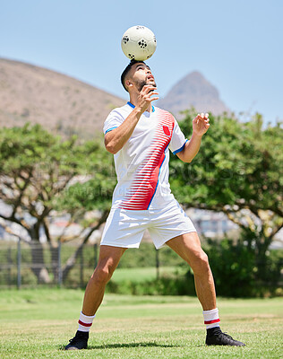 Fitness, man and soccer in sports training, exercise or workout for control on the field in the outdoors. Athletic male in football sport trick balancing ball on the head for practice in South Africa