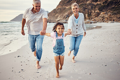 Buy stock photo Beach, running and child holding hands with grandparents for a lovely bonding experience on holiday vacation. Happy, grandmother and old man having fun enjoying an exercise with a kid as a family
