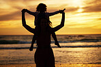 Silhouette, sunset and mother with a child on the beach while on summer vacation or adventure. Love, care and shadow of family in nature by the ocean or sea on holiday journey together in the evening