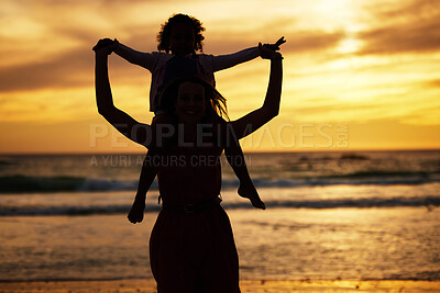 Buy stock photo Silhouette, sunset and mother with a child on the beach while on summer vacation or adventure. Love, care and shadow of family in nature by the ocean or sea on holiday journey together in the evening