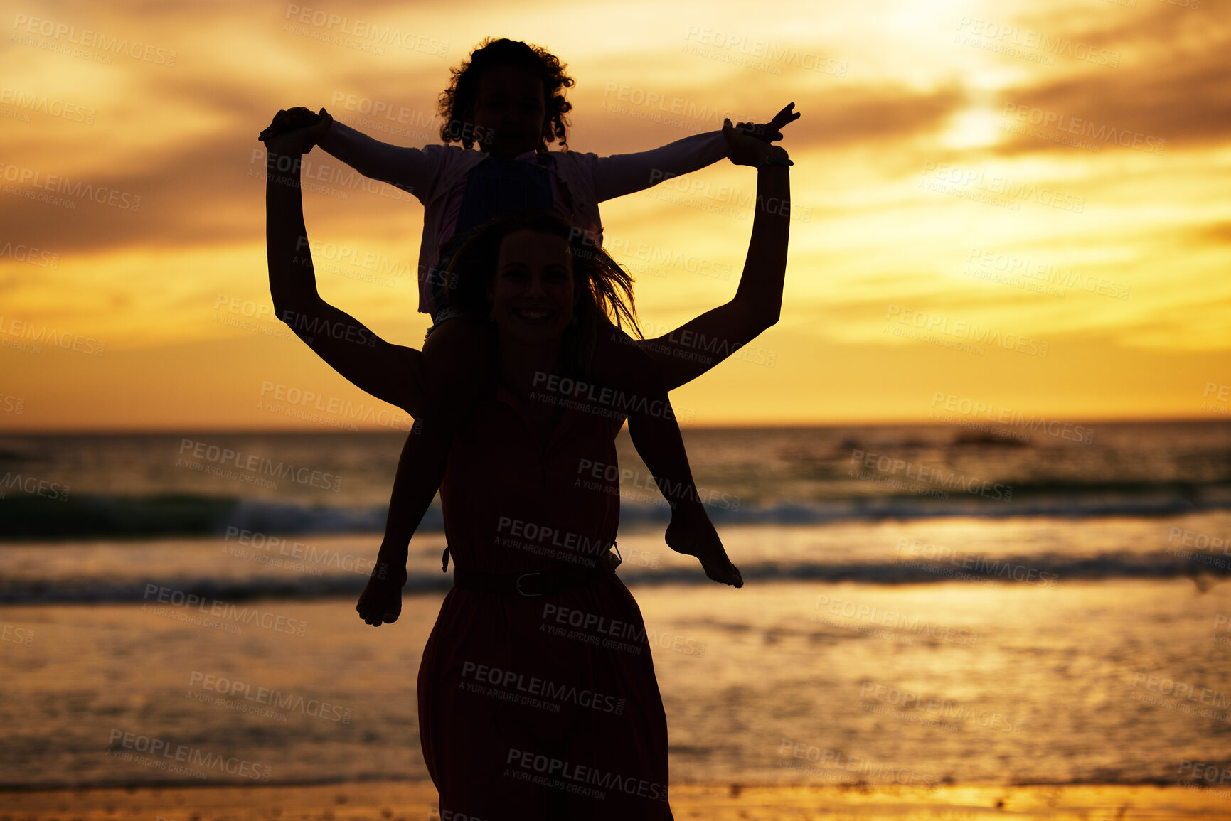 Buy stock photo Silhouette, sunset and mother with a child on the beach while on summer vacation or adventure. Love, care and shadow of family in nature by the ocean or sea on holiday journey together in the evening