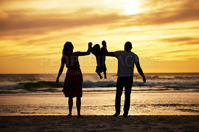 Buy stock photo Beach silhouette, family holding child and sunset ocean holiday by waves, sand and summer sun background. Scenic travel vacation, relax by sea and swinging child together with love, care and freedom 