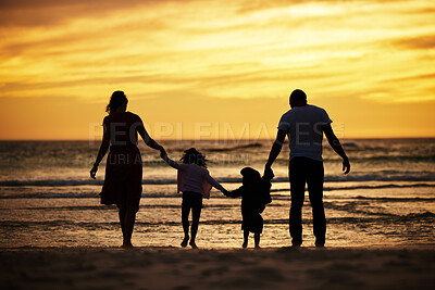 Buy stock photo Family, holding hands and silhouette at the beach at sunset, adventure and love with parents and children outdoor. Mother, father and kids together, trust and freedom by the ocean, nature and care.